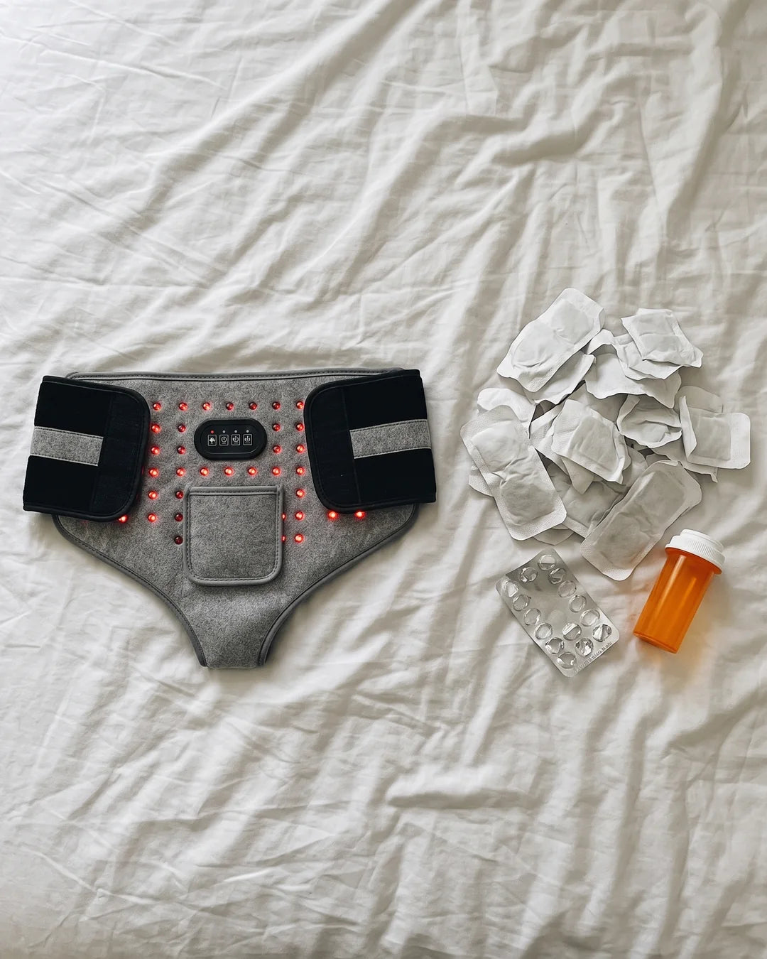 The brief next to a year of used heat patches and painkillers